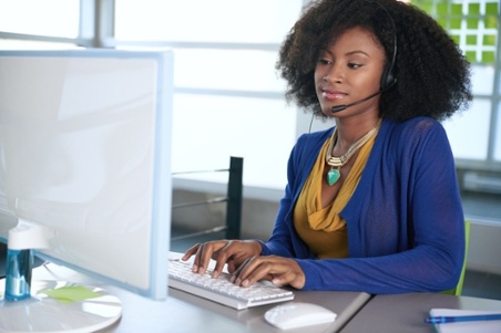 African American female agent working at desk