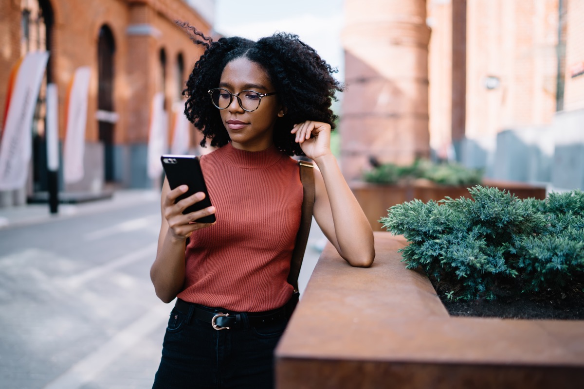 African American Woman on Mobile Phone outside