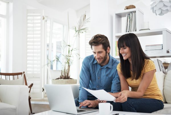 A woman and a man on a computer