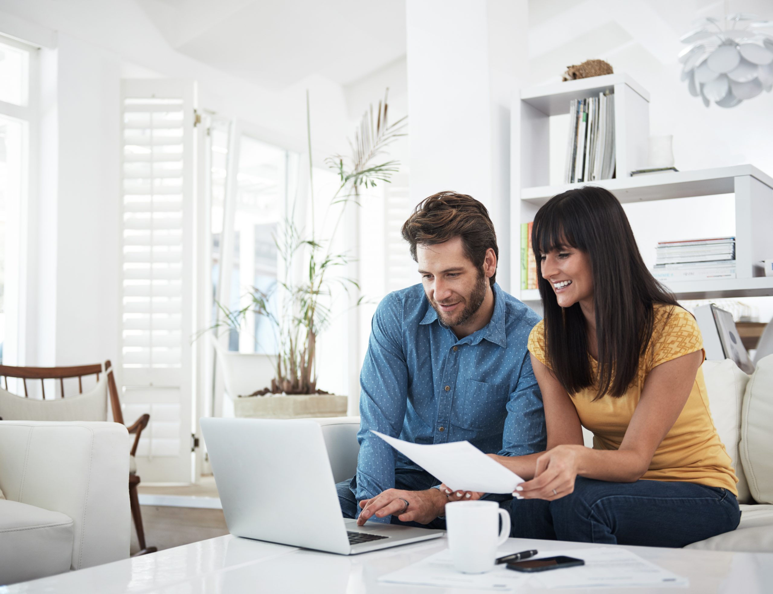 A woman and a man on a computer