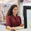 Woman talking on headset.