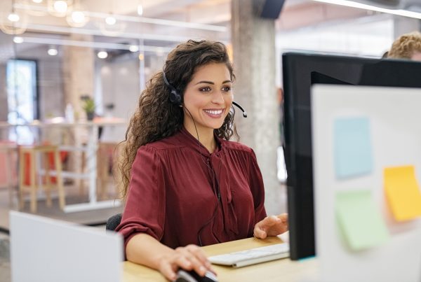 Woman talking on headset.